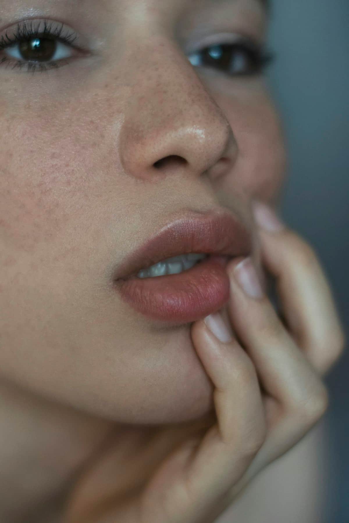 Close natural-light portrait showing honest, healthy skin texture